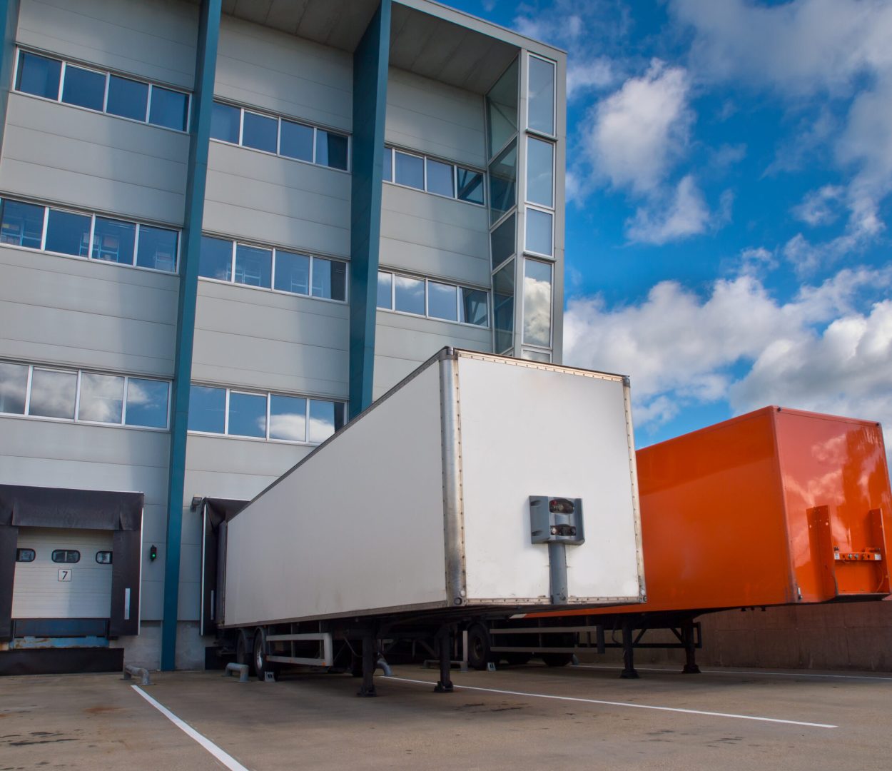 Red and White Trailer in Front of Docking Bay ready for Transport